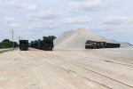 Stone empties and loads wait at the quarry